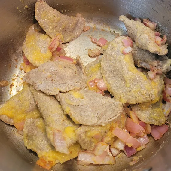 wfpb vegan pierogies covered in cauli-butter and caramelized onions