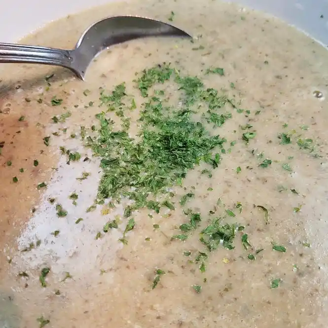Boil & Blend Creamy Mushroom Soup taking a spoonful